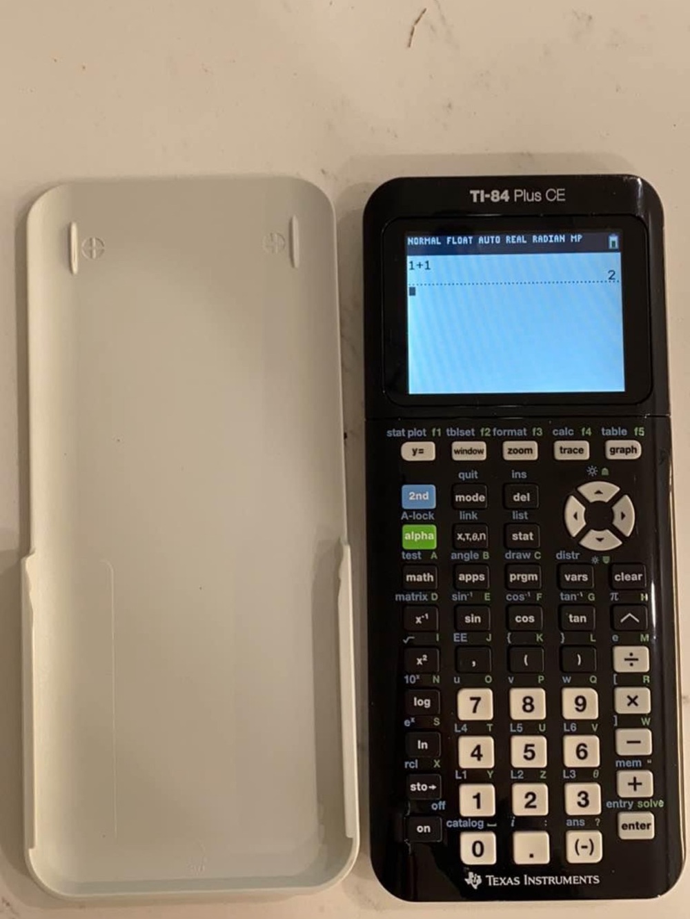 TI-84 Plus CE Graphing Calculator in Black with White Cover